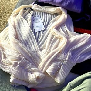 Stunning cream blouse with beautiful detail.